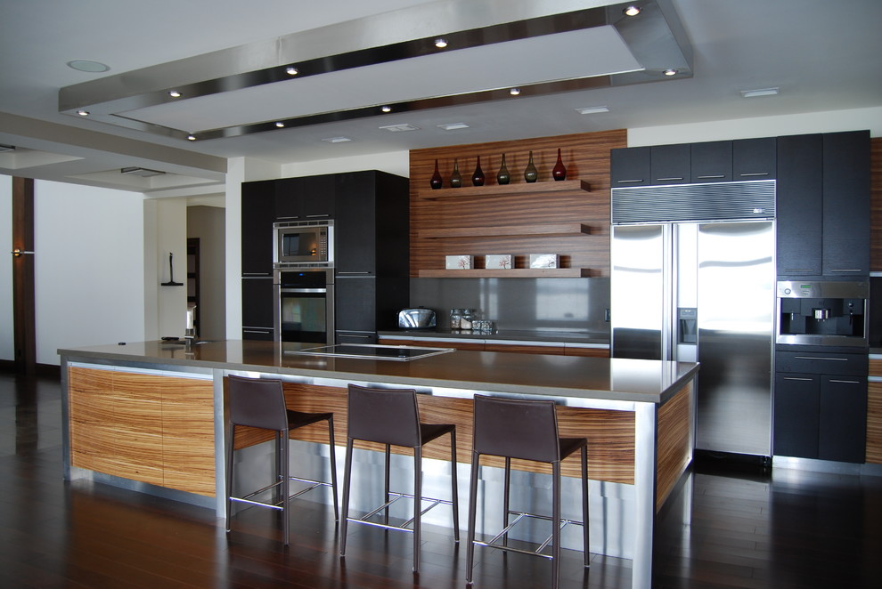Minimalist galley eat-in kitchen photo in Toronto with an undermount sink, flat-panel cabinets, dark wood cabinets, gray backsplash, stainless steel appliances, an island and solid surface countertops
