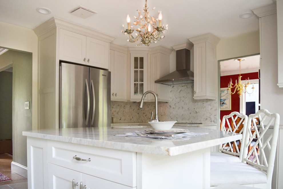 Eat-in kitchen - small country u-shaped limestone floor eat-in kitchen idea in New York with a drop-in sink, recessed-panel cabinets, white cabinets, quartzite countertops, gray backsplash, stone tile backsplash, stainless steel appliances and an island
