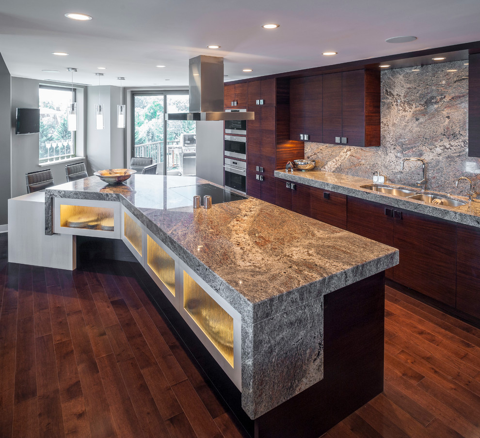 Large trendy l-shaped dark wood floor and brown floor kitchen pantry photo in Cincinnati with a double-bowl sink, flat-panel cabinets, dark wood cabinets, granite countertops, multicolored backsplash, stone slab backsplash, stainless steel appliances and an island