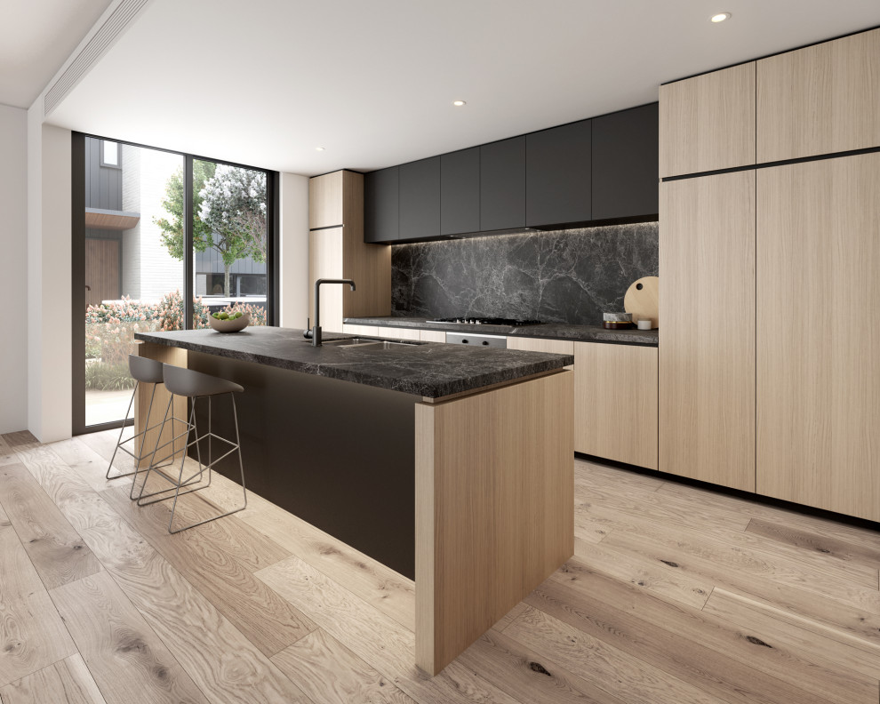 Large trendy galley light wood floor open concept kitchen photo in Melbourne with tile countertops, a double-bowl sink, recessed-panel cabinets, black backsplash, porcelain backsplash, black appliances, an island and black countertops