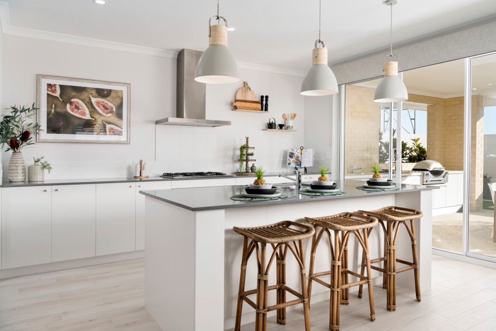 Inspiration for a contemporary l-shaped light wood floor and beige floor kitchen remodel in Perth with an undermount sink, flat-panel cabinets, white cabinets, white backsplash, an island and gray countertops
