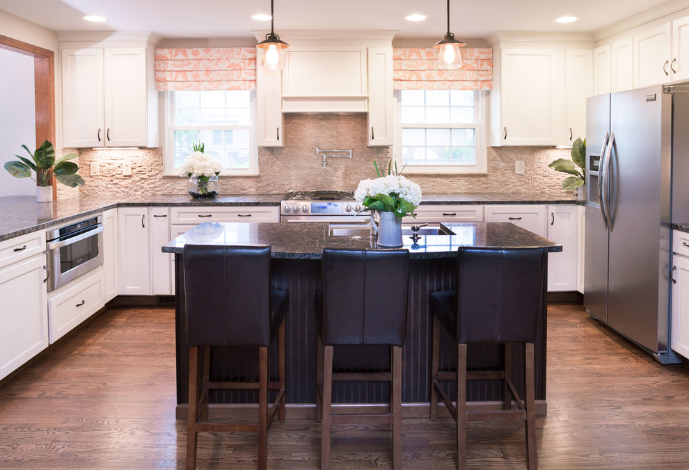 Inspiration for a mid-sized contemporary u-shaped medium tone wood floor and brown floor eat-in kitchen remodel in Columbus with an integrated sink, shaker cabinets, white cabinets, granite countertops, beige backsplash, stone tile backsplash, stainless steel appliances and an island