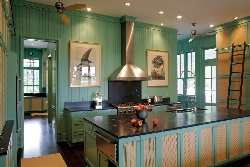 Photo of a country kitchen in Atlanta with a submerged sink, recessed-panel cabinets, green cabinets, soapstone worktops, black splashback, stone slab splashback and stainless steel appliances.