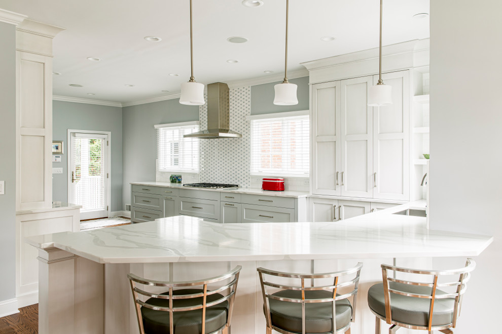 Example of a transitional dark wood floor kitchen design in New York with an undermount sink, shaker cabinets, white cabinets, quartz countertops, white backsplash, subway tile backsplash, paneled appliances and white countertops