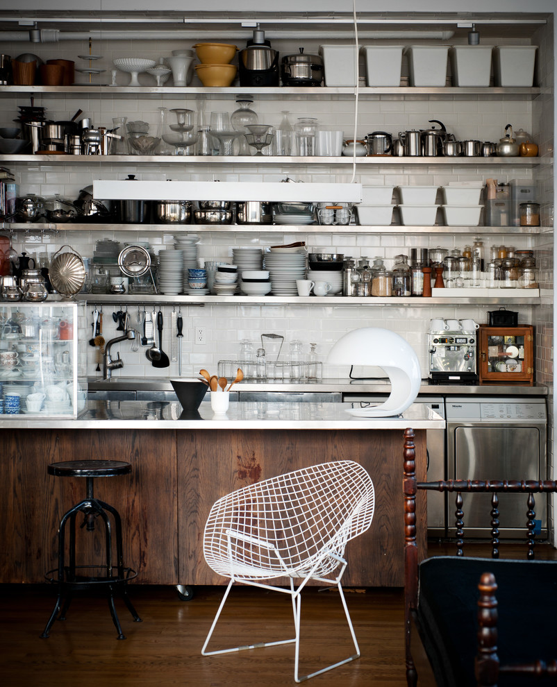 Inspiration for an urban kitchen in New York with an integrated sink and stainless steel worktops.