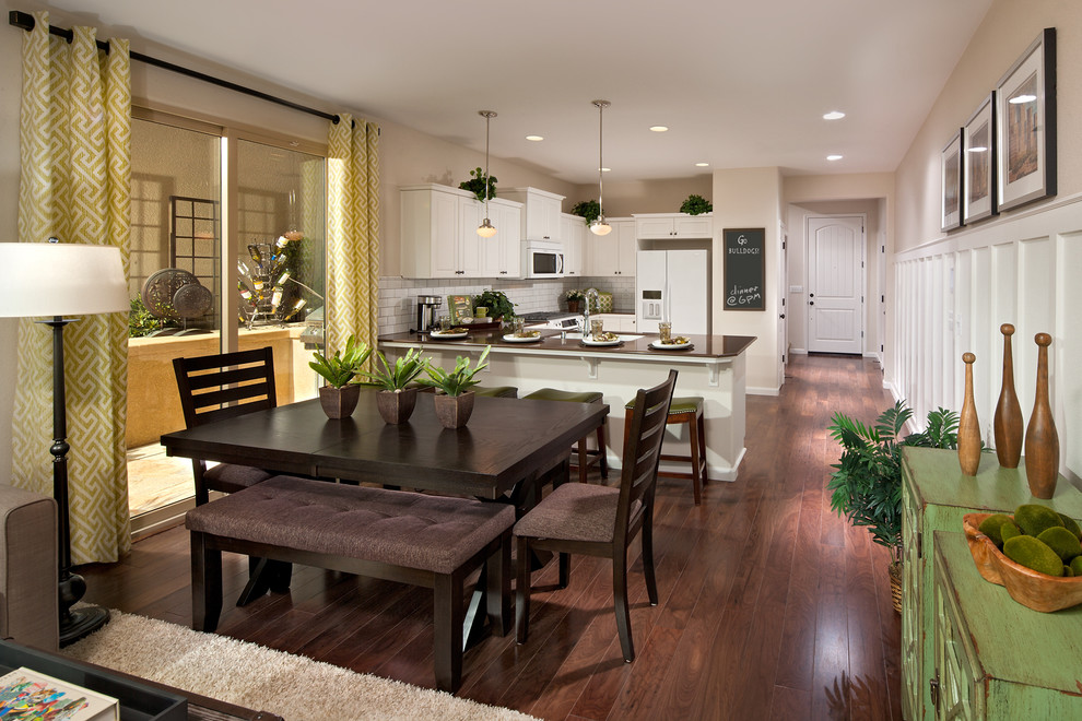 Eat-in kitchen - mid-sized contemporary u-shaped medium tone wood floor eat-in kitchen idea in Other with a drop-in sink, beaded inset cabinets, white cabinets, granite countertops, white backsplash, ceramic backsplash, white appliances and a peninsula