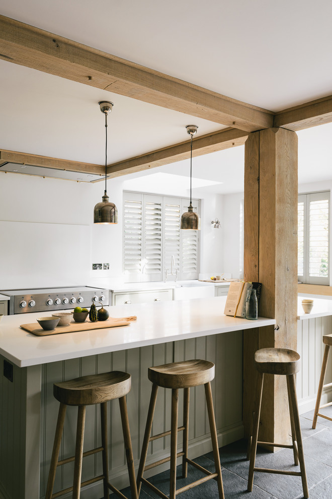 Inspiration for a large rural single-wall open plan kitchen in Other with a belfast sink, shaker cabinets, grey cabinets, quartz worktops, white splashback and an island.