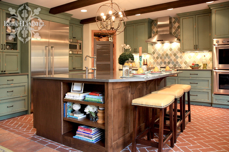 Eat-in kitchen - rustic l-shaped eat-in kitchen idea in Minneapolis with an undermount sink, green cabinets, multicolored backsplash, mosaic tile backsplash and stainless steel appliances