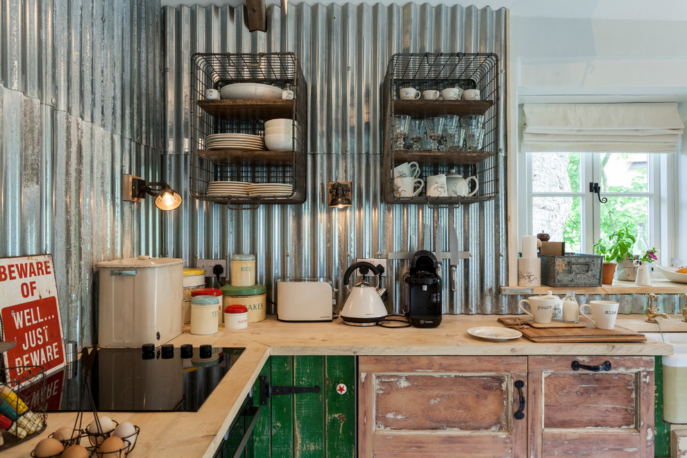 Cottage chic kitchen photo in London
