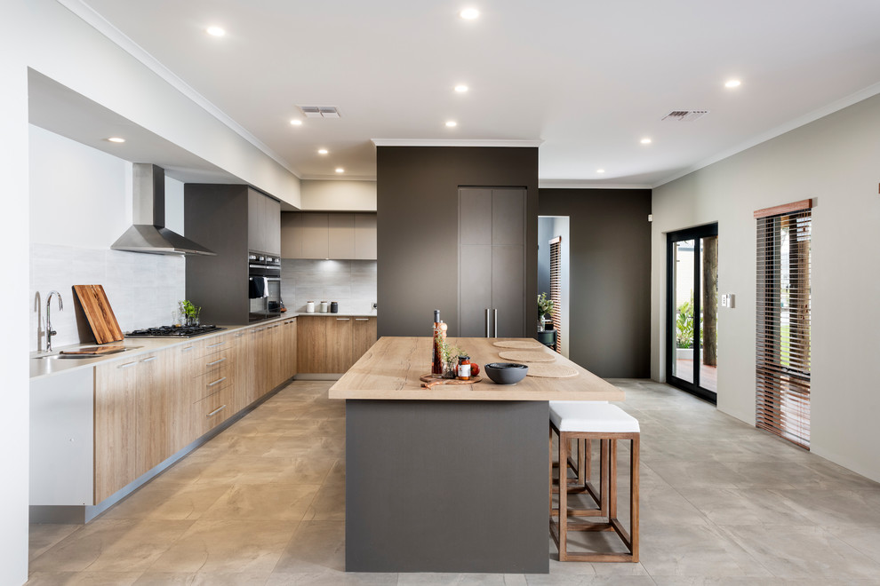 Inspiration for a large contemporary kitchen in Perth with light wood cabinets, white splashback and an island.