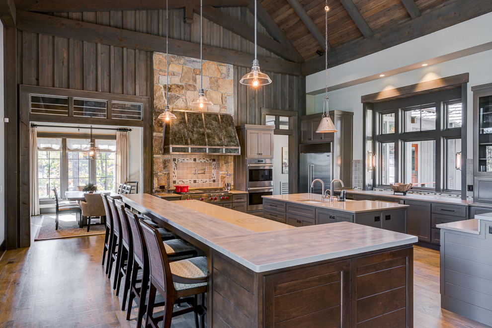 Inspiration for a rustic kitchen in Other with a submerged sink, shaker cabinets, grey cabinets, multi-coloured splashback, stainless steel appliances, multiple islands and dark hardwood flooring.