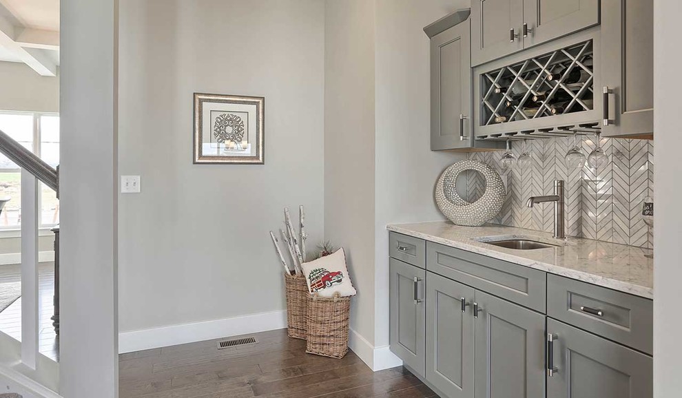 Large traditional grey and cream single-wall kitchen pantry in Other with grey cabinets.