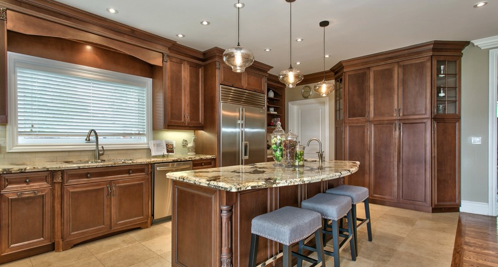 Large elegant l-shaped ceramic tile and beige floor open concept kitchen photo in Toronto with an undermount sink, medium tone wood cabinets, granite countertops, beige backsplash, stone tile backsplash, stainless steel appliances, an island and beaded inset cabinets