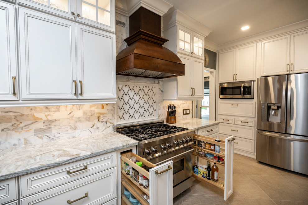 Large elegant l-shaped porcelain tile and beige floor open concept kitchen photo in Atlanta with a farmhouse sink, flat-panel cabinets, white cabinets, marble countertops, multicolored backsplash, marble backsplash, stainless steel appliances, an island and white countertops
