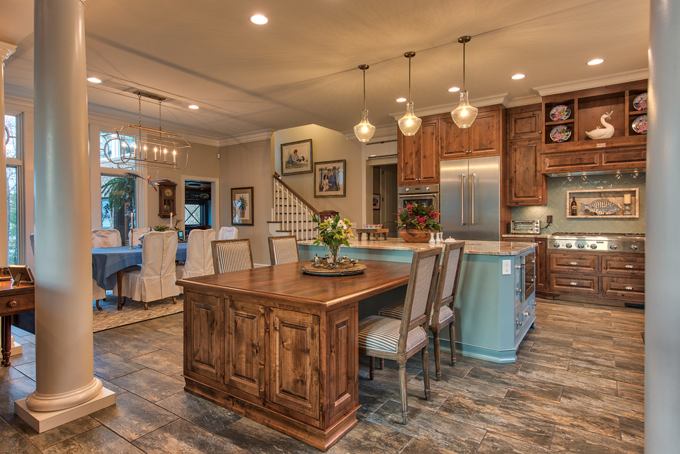 Eat-in kitchen - large transitional u-shaped porcelain tile and blue floor eat-in kitchen idea in Other with an undermount sink, raised-panel cabinets, medium tone wood cabinets, quartzite countertops, blue backsplash, glass tile backsplash, stainless steel appliances and an island
