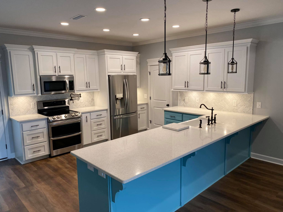 Eat-in kitchen - craftsman u-shaped medium tone wood floor and brown floor eat-in kitchen idea in Other with a farmhouse sink, shaker cabinets, white cabinets, marble countertops, white backsplash, slate backsplash, stainless steel appliances, an island and yellow countertops
