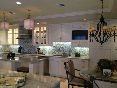 White cabinets with glass mosaics backsplash