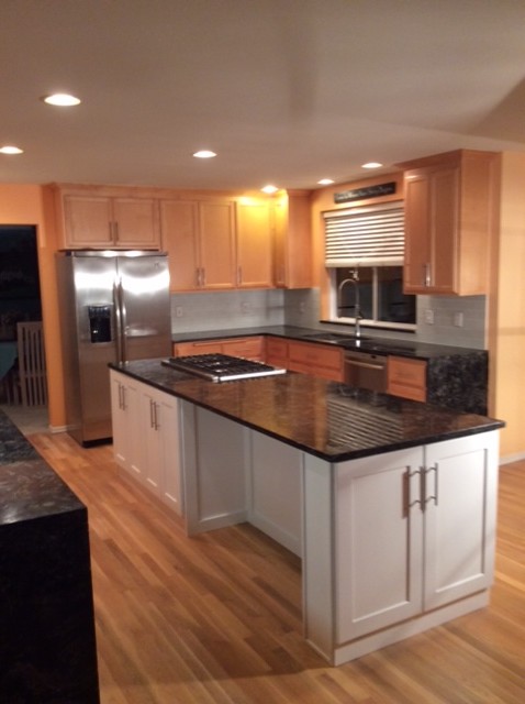 Photo of a large classic u-shaped kitchen/diner in Seattle with shaker cabinets, white cabinets, granite worktops and an island.