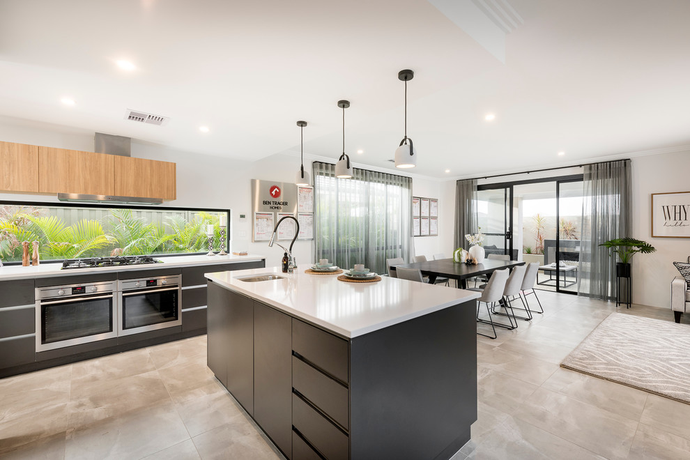 This is an example of a medium sized modern galley open plan kitchen in Perth with a built-in sink, flat-panel cabinets, black cabinets, engineered stone countertops, stainless steel appliances, porcelain flooring and an island.