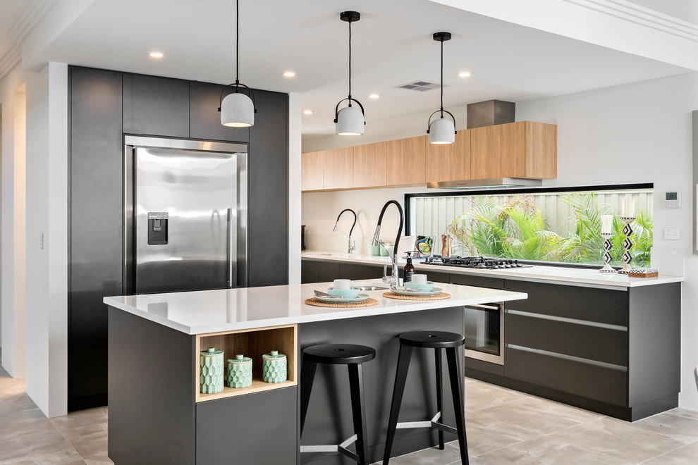 Inspiration for a medium sized contemporary l-shaped open plan kitchen in Perth with a built-in sink, flat-panel cabinets, black cabinets, engineered stone countertops, stainless steel appliances, porcelain flooring, an island, glass sheet splashback and grey floors.