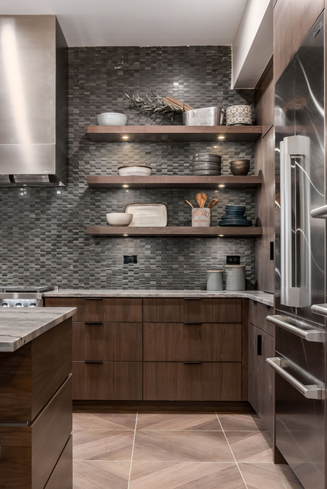Ejemplo de cocina moderna con fregadero encastrado, armarios con paneles lisos, electrodomésticos de acero inoxidable y una isla
