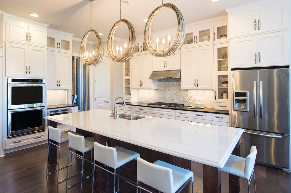 Example of a transitional dark wood floor kitchen design in Raleigh with a double-bowl sink, beaded inset cabinets, dark wood cabinets, gray backsplash, mosaic tile backsplash, stainless steel appliances and an island