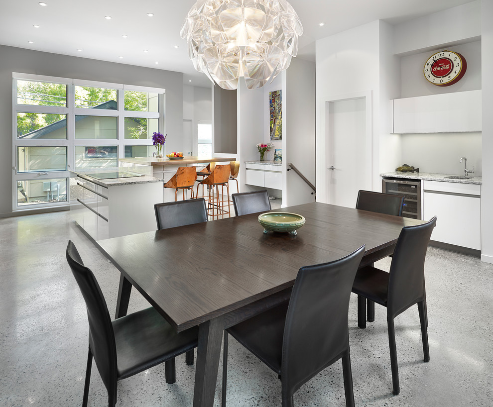 Eat-in kitchen - contemporary eat-in kitchen idea in Edmonton with flat-panel cabinets and white cabinets