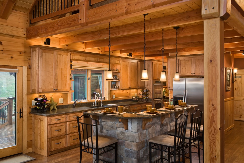 This is an example of a large rustic galley open plan kitchen in Charlotte with a submerged sink, medium wood cabinets, quartz worktops, stainless steel appliances, dark hardwood flooring, an island and shaker cabinets.
