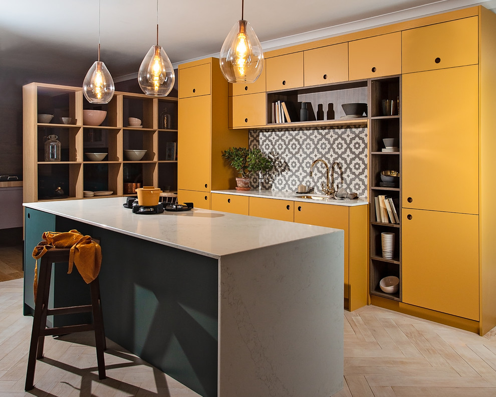 Large contemporary open plan kitchen in Other with a single-bowl sink, flat-panel cabinets, yellow cabinets, composite countertops, grey splashback, ceramic splashback, integrated appliances, plywood flooring, an island, white floors and white worktops.
