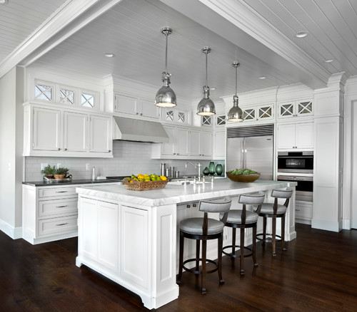 Elegant Canadian kitchen with white quartz countertops, large island seating, and classic shaker cabinetry for Quartz vs Granite Countertops comparison