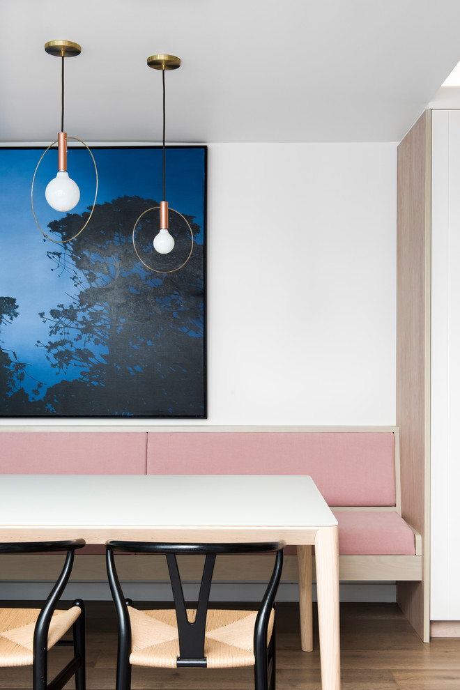 Medium sized contemporary open plan dining room in Sydney with medium hardwood flooring.