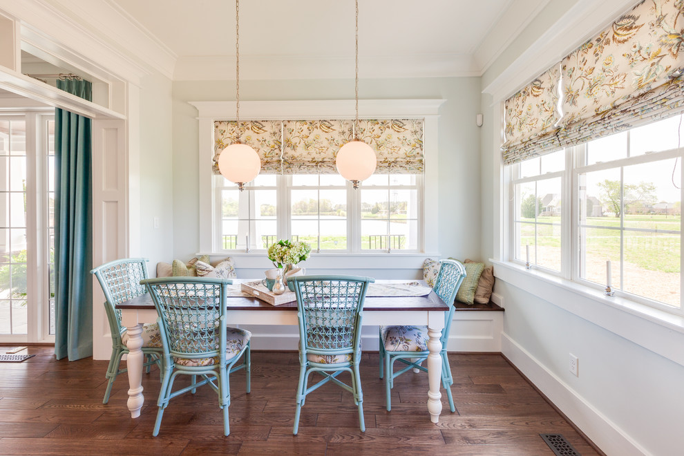 Elegant medium tone wood floor dining room photo in Other