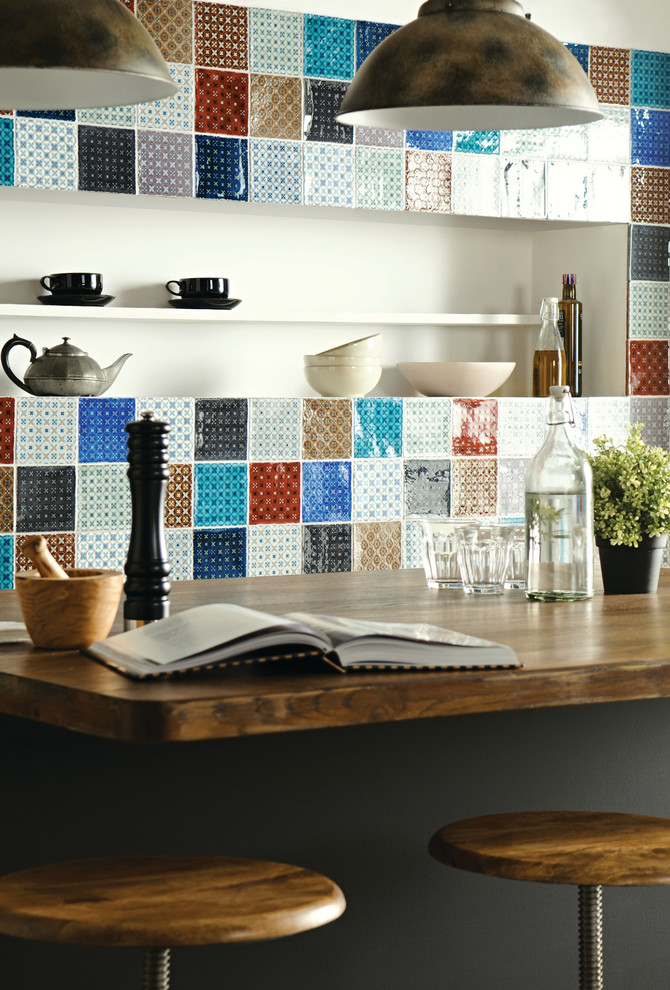 Rustic kitchen in Devon with multi-coloured splashback and ceramic splashback.