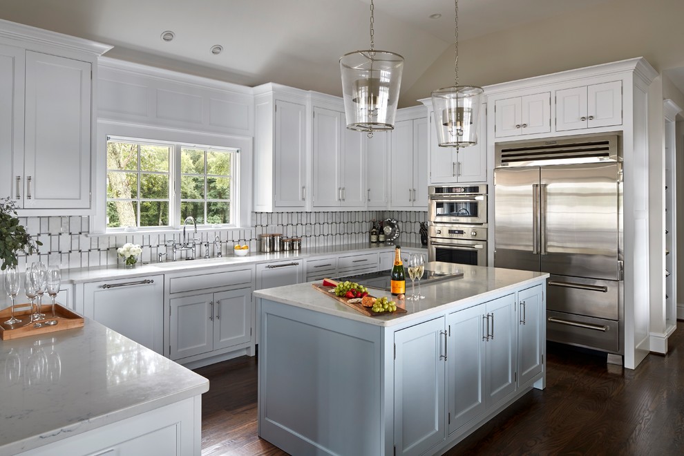 Enclosed kitchen - mid-sized coastal u-shaped medium tone wood floor and brown floor enclosed kitchen idea in Bridgeport with an undermount sink, beaded inset cabinets, white cabinets, gray backsplash, marble backsplash, stainless steel appliances, an island and granite countertops