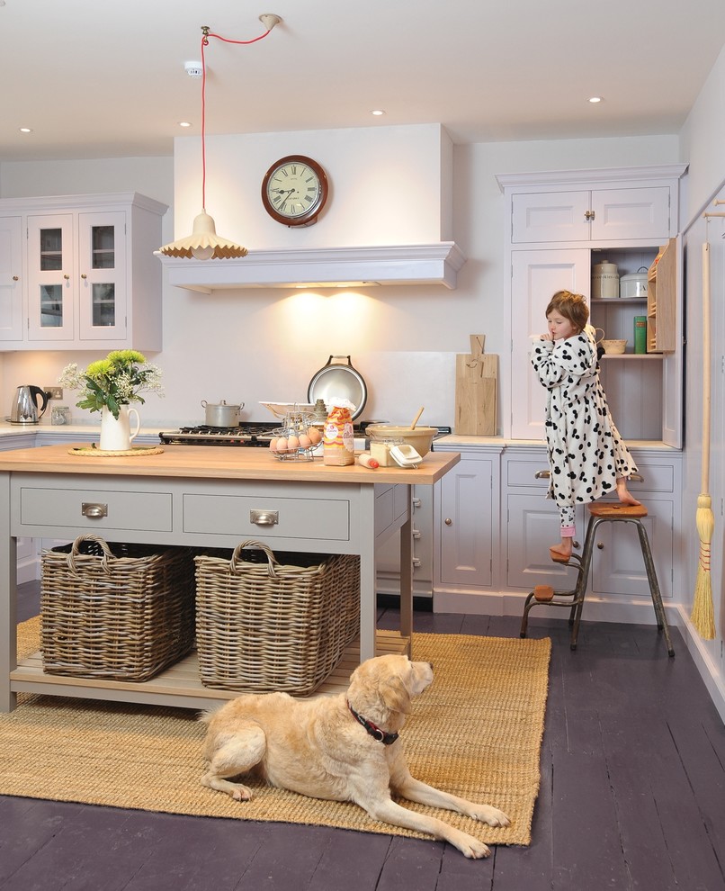 Inspiration for a mid-sized timeless l-shaped painted wood floor kitchen remodel in Wiltshire with an undermount sink, raised-panel cabinets, gray cabinets, marble countertops, gray backsplash, colored appliances and an island