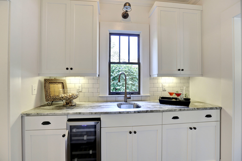 This is an example of a medium sized rural galley kitchen in Atlanta with shaker cabinets, white cabinets, quartz worktops, white splashback and ceramic splashback.
