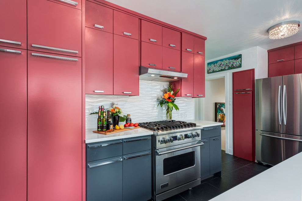 Mid-sized minimalist galley porcelain tile enclosed kitchen photo in Calgary with flat-panel cabinets, white backsplash, stainless steel appliances, red cabinets, an island, an undermount sink, quartz countertops and ceramic backsplash