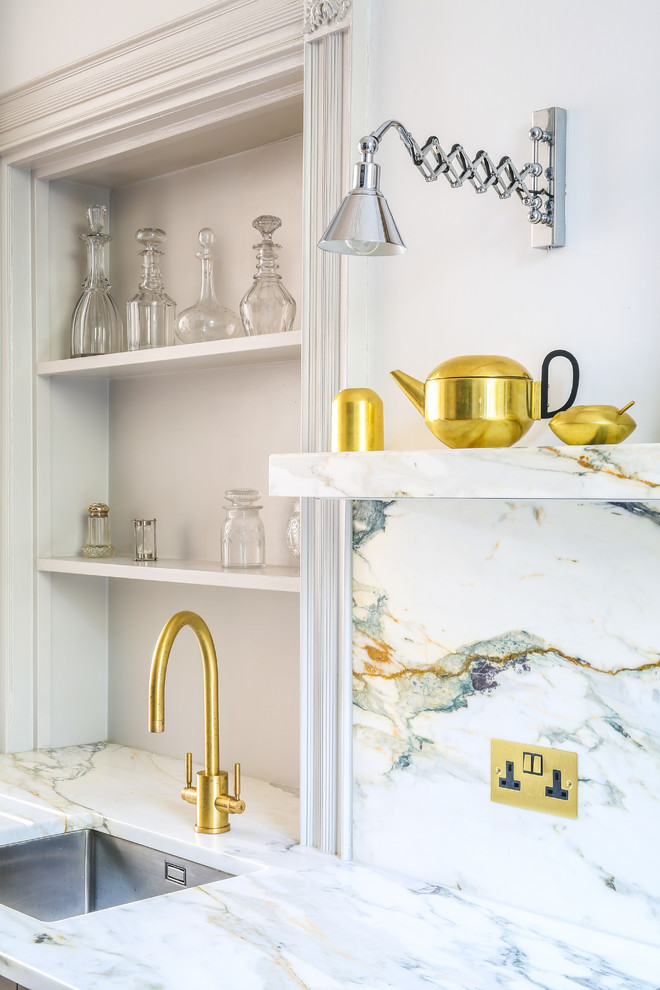 Photo of a medium sized contemporary l-shaped kitchen/diner in Other with a submerged sink, flat-panel cabinets, stainless steel cabinets, marble worktops, multi-coloured splashback, marble splashback, stainless steel appliances, light hardwood flooring, no island and yellow floors.