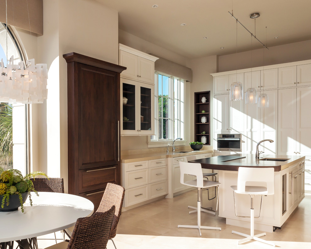 Imagen de cocina actual con fregadero bajoencimera, armarios con paneles empotrados y puertas de armario blancas