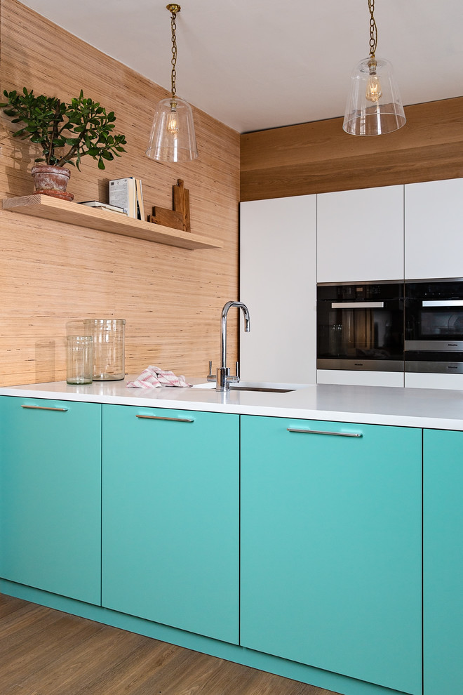 Design ideas for a small scandi kitchen in Other with flat-panel cabinets, blue cabinets, quartz worktops, stainless steel appliances, ceramic flooring, an island, beige floors and white worktops.