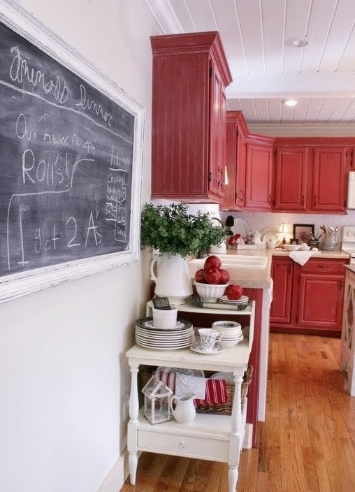 Kitchen - traditional kitchen idea in Other with red cabinets