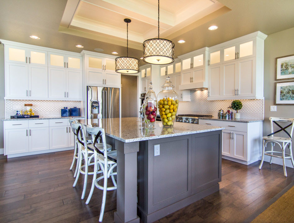 Eat-in kitchen - large cottage l-shaped dark wood floor and brown floor eat-in kitchen idea in Boise with shaker cabinets, white cabinets, granite countertops, white backsplash, porcelain backsplash, stainless steel appliances, an island and a farmhouse sink