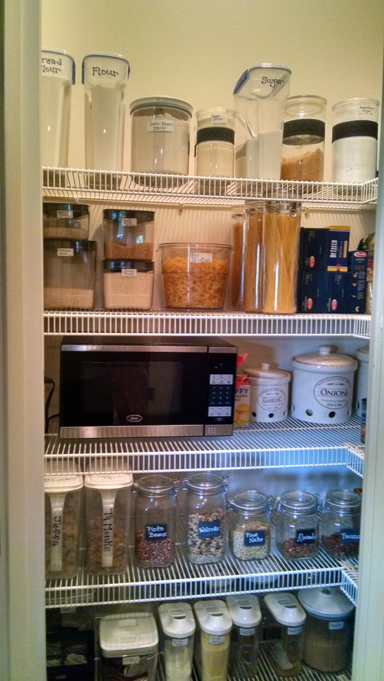 This is an example of a small traditional l-shaped kitchen pantry in DC Metro.