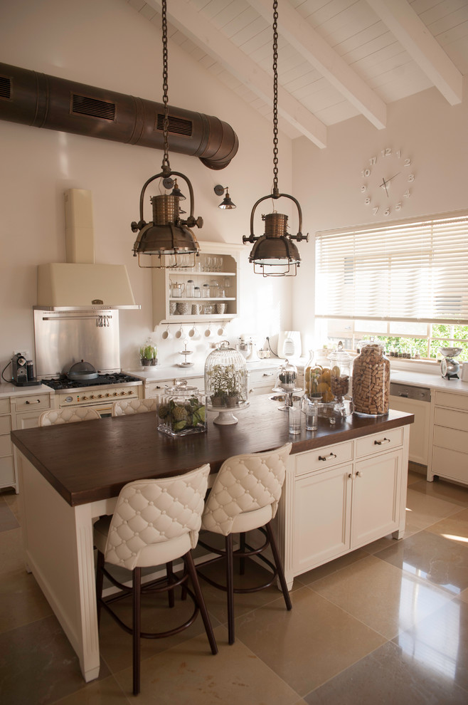 Inspiration for a transitional kitchen remodel in Tel Aviv with recessed-panel cabinets, beige cabinets, wood countertops, an island and white appliances
