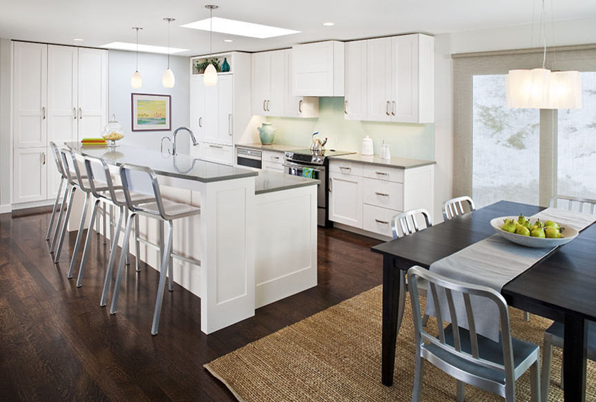 Inspiration for a mid-sized contemporary l-shaped dark wood floor eat-in kitchen remodel in Minneapolis with shaker cabinets, white cabinets, paneled appliances and an island