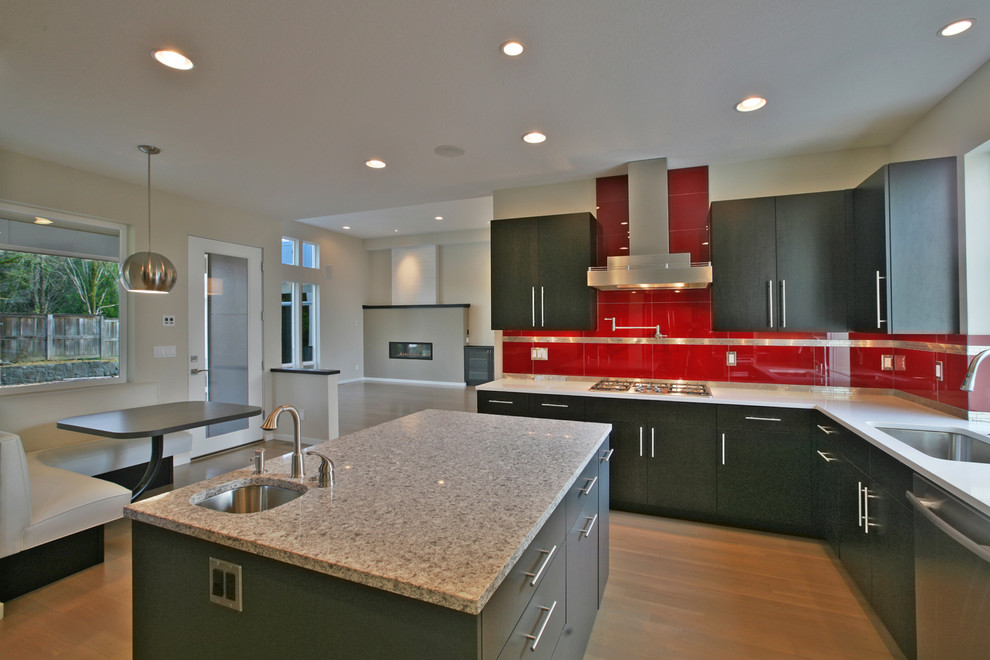 Trendy eat-in kitchen photo in Portland with a single-bowl sink, flat-panel cabinets, gray cabinets and red backsplash