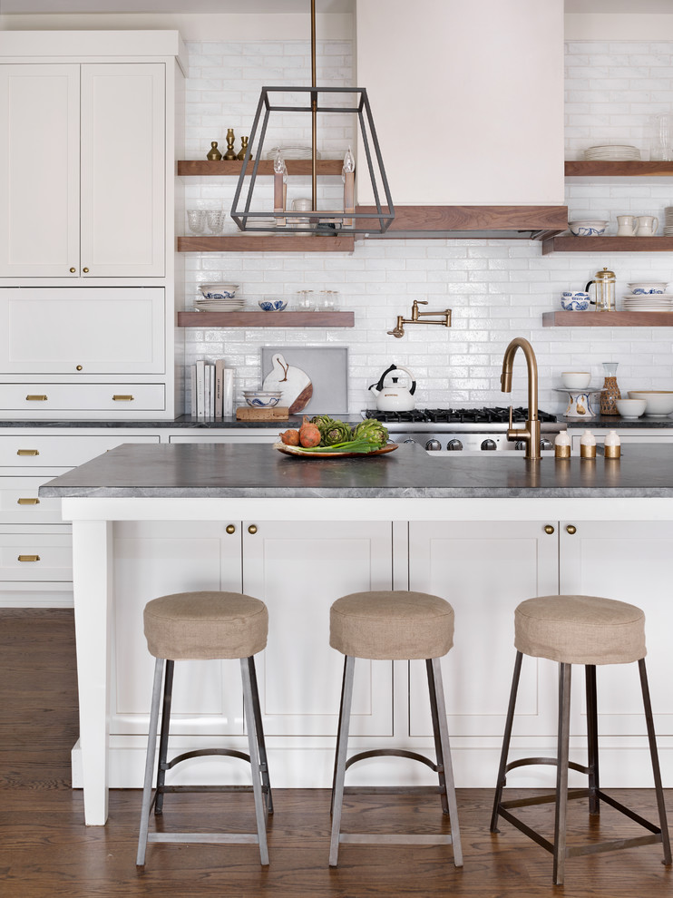 Kitchen - transitional dark wood floor kitchen idea in Atlanta with shaker cabinets, white cabinets, white backsplash, subway tile backsplash and an island
