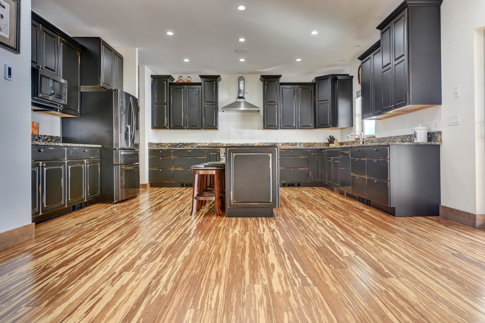 Mountain style bamboo floor and multicolored floor kitchen photo in Other