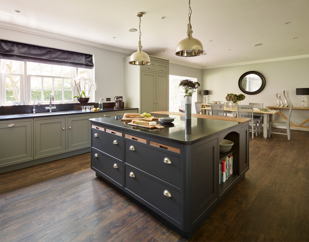 This is an example of a medium sized classic l-shaped kitchen/diner in Essex with an island.