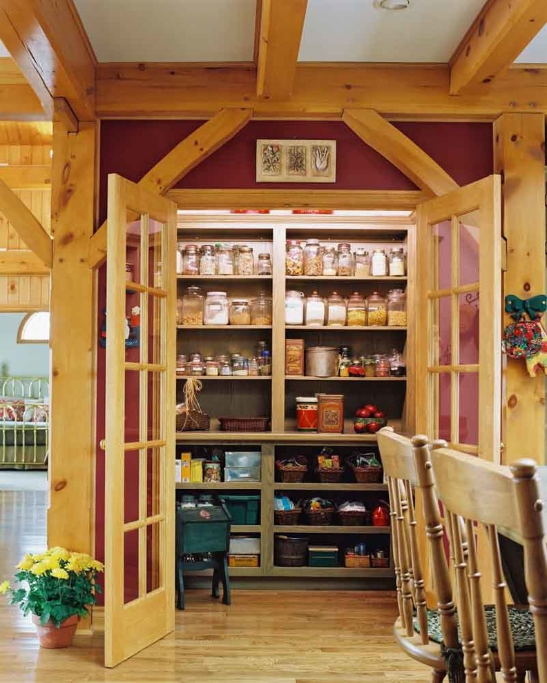 Small rustic l-shaped kitchen pantry in Toronto with open cabinets and medium hardwood flooring.